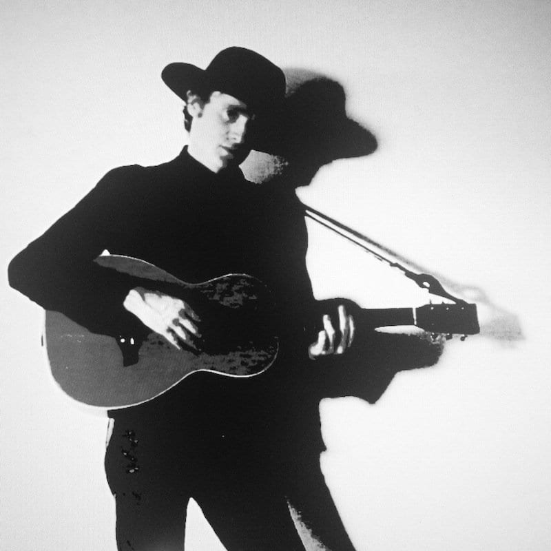 Ethan Gold Black and White with guitar and hat